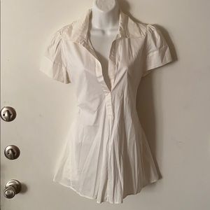 White blouse with black tie in back